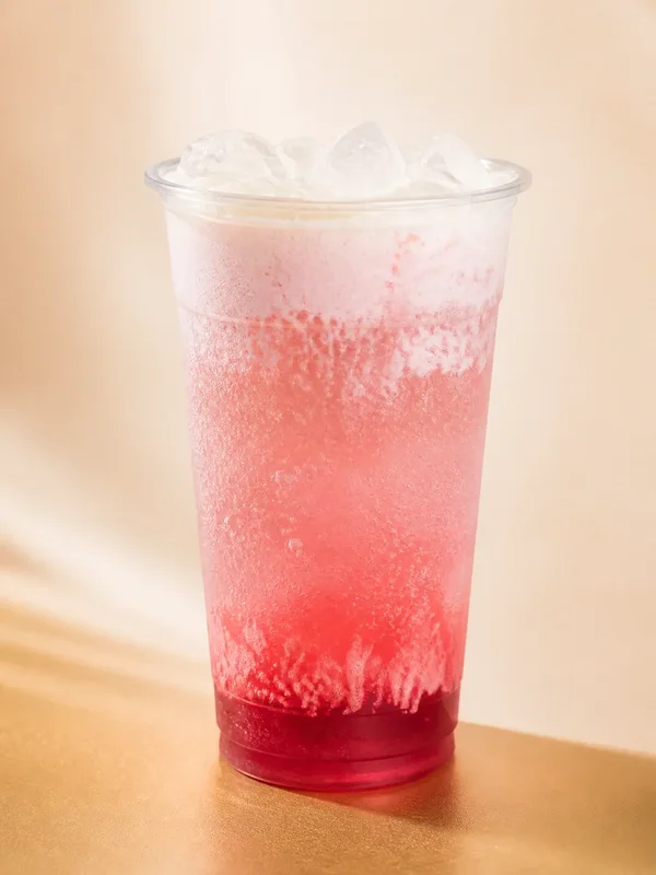 Pom Peach dirty soda with bright red and cream layers